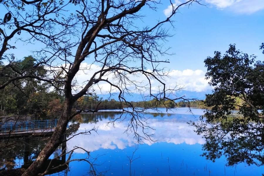 Ghoda Ghodi Lake with perfect mirror reflection of sky and trees
